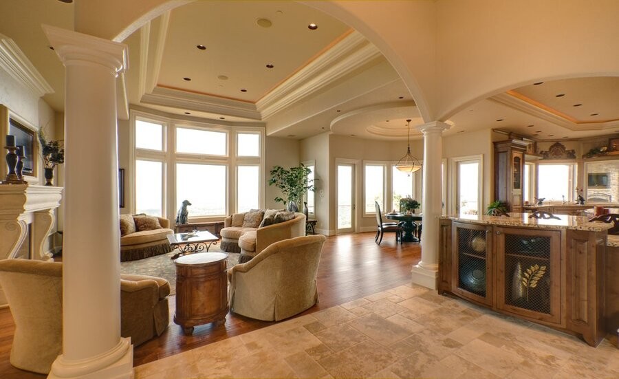 A large, open living space featuring in-ceiling speakers and lighting fixtures.