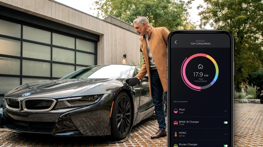  Inset image of Savant app showing top energy consuming devices with a man opening a car door in the background.