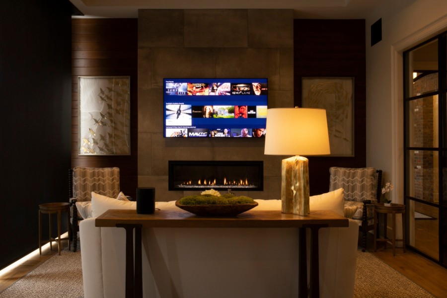 Inviting living room with a fireplace and a wall-mounted TV.