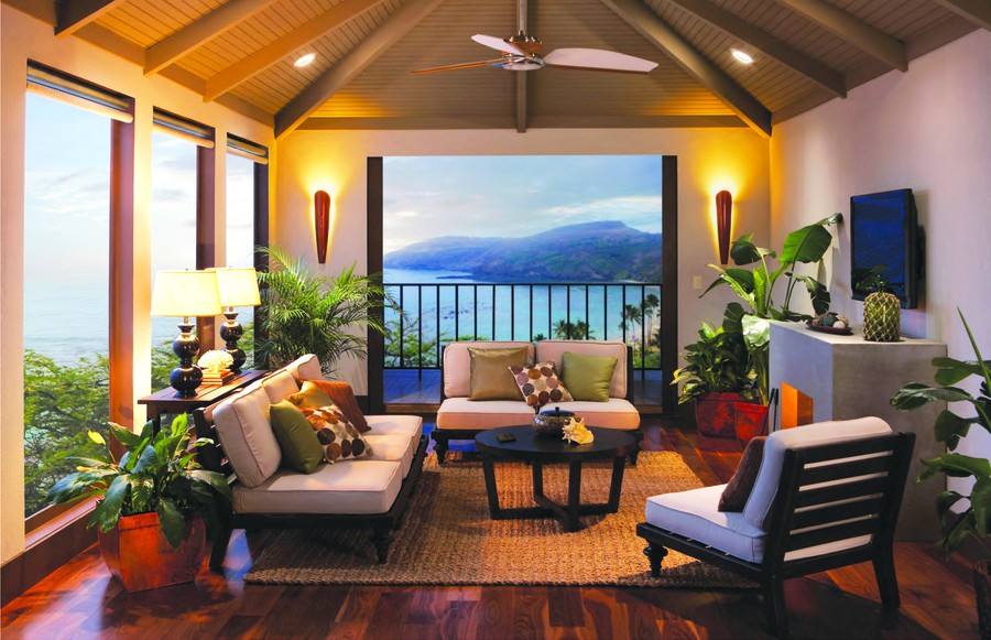  A living area with floor-to-ceiling windows, motorized shades, and warm automated lighting.