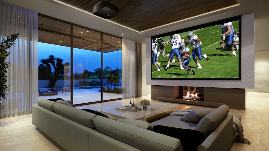 Luxurious media room with a football game playing on the TV.