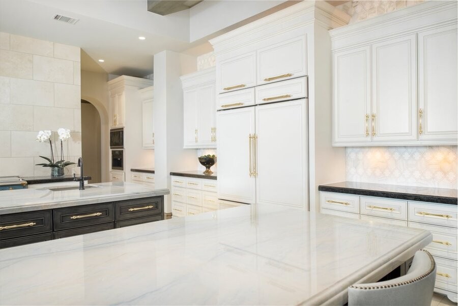 A warmly-lit kitchen space with Ketra Lighting fixtures.