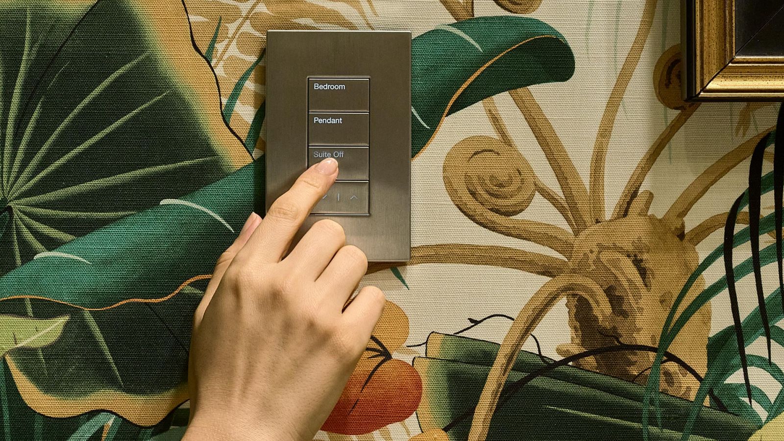 Open-concept kitchen and dining area with warm lighting and poolside view