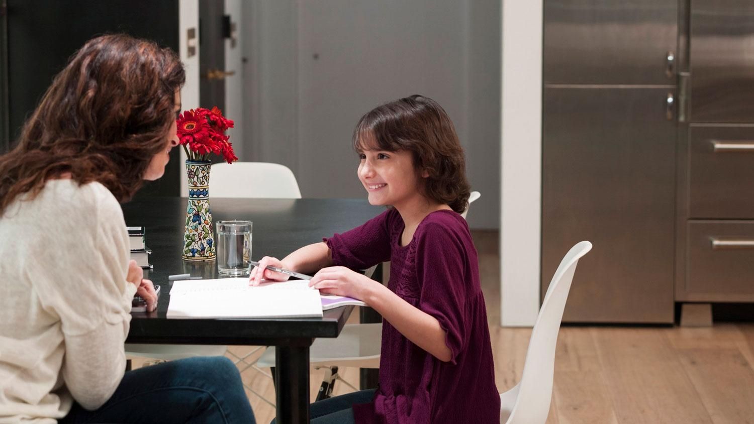 Mother and daughter enjoying a well-lit kitchen, enhanced by Ketra’s natural light technology, creating a warm and inviting atmosphere.